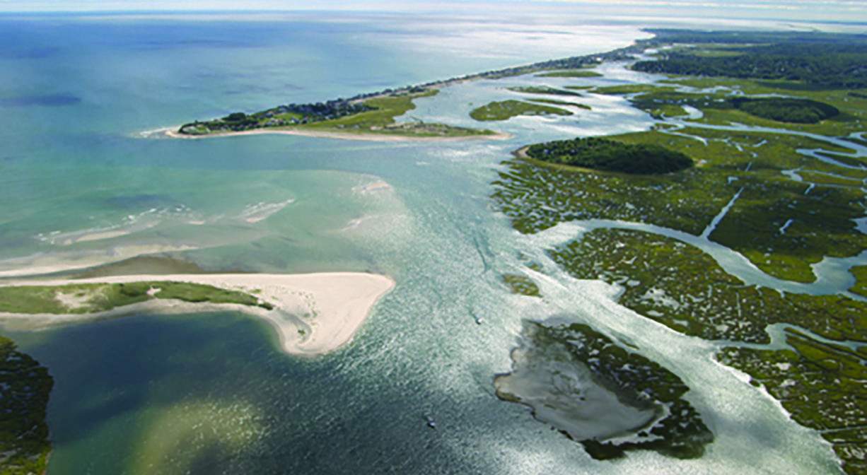 Aerial photograph of the mouth of the North River with The Spit, a sand spit, on one side.