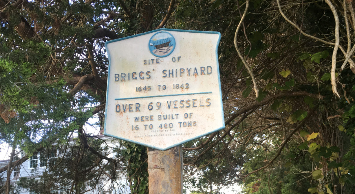 A photograph of a historic marker for Briggs Shipyard.