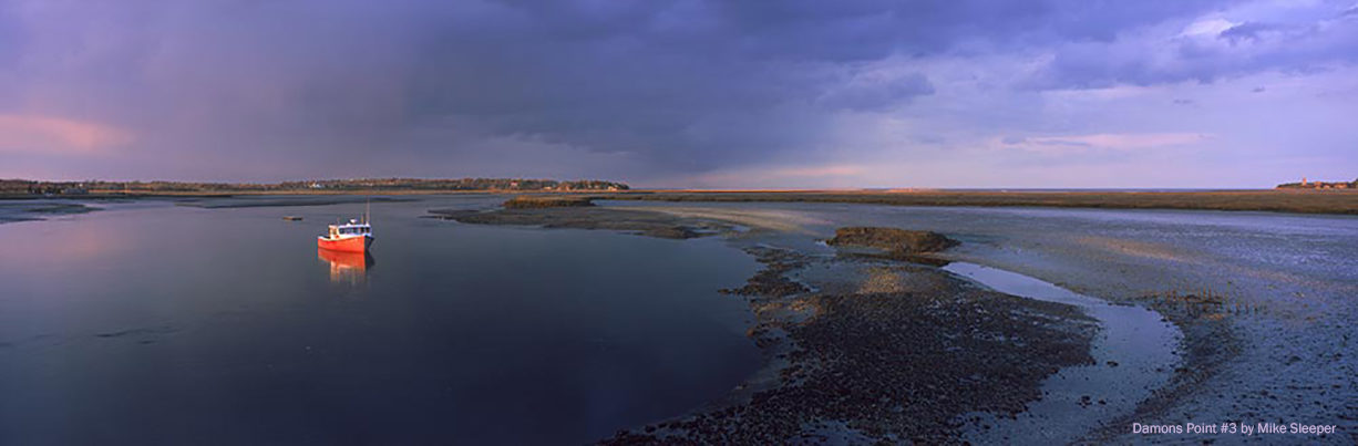 A river and salt marsh at sunset.