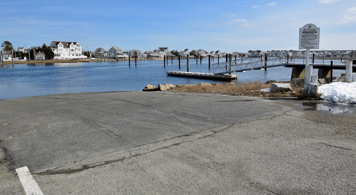 A launch ramp leading to a river on a sunny day.