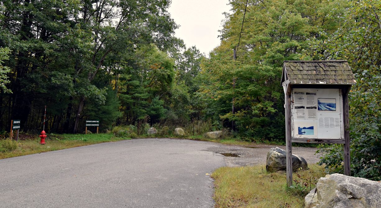 A photograph of a larking area with an informational kiosk.