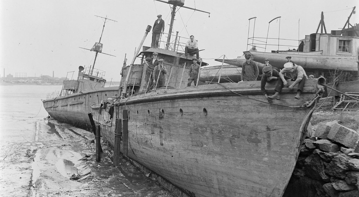 A black & white photograph of a shipwreck.