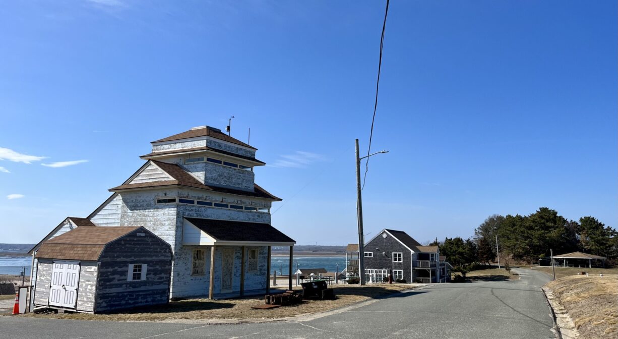 A photograph of a building with a river in the background.