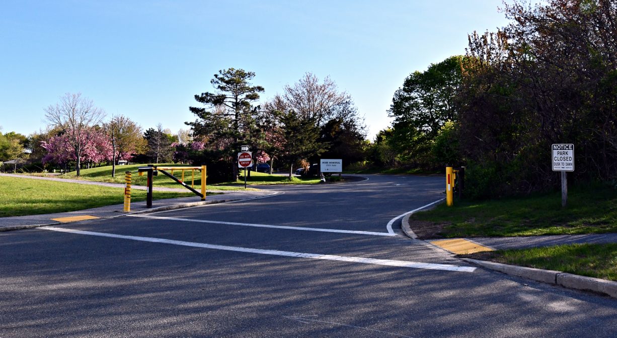 A photograph of a parking area with gates.