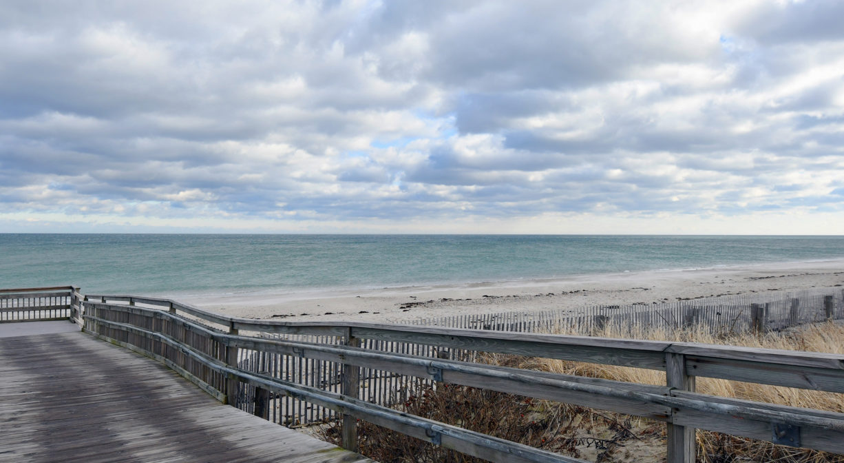 A photograph of a large wooden access ramp to a beach.