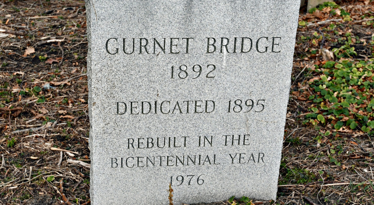 A photograph of a granite historic marker for Gurnet Bridge.