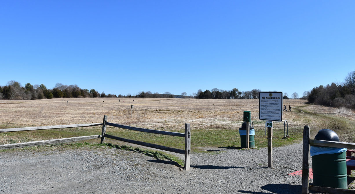 A photograph of a parking area and trailhead.