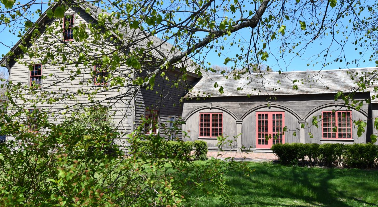 A photograph of a historic home, as viewed from the side.
