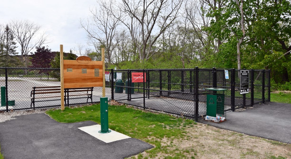 A photograph of the entrance to a dog park.