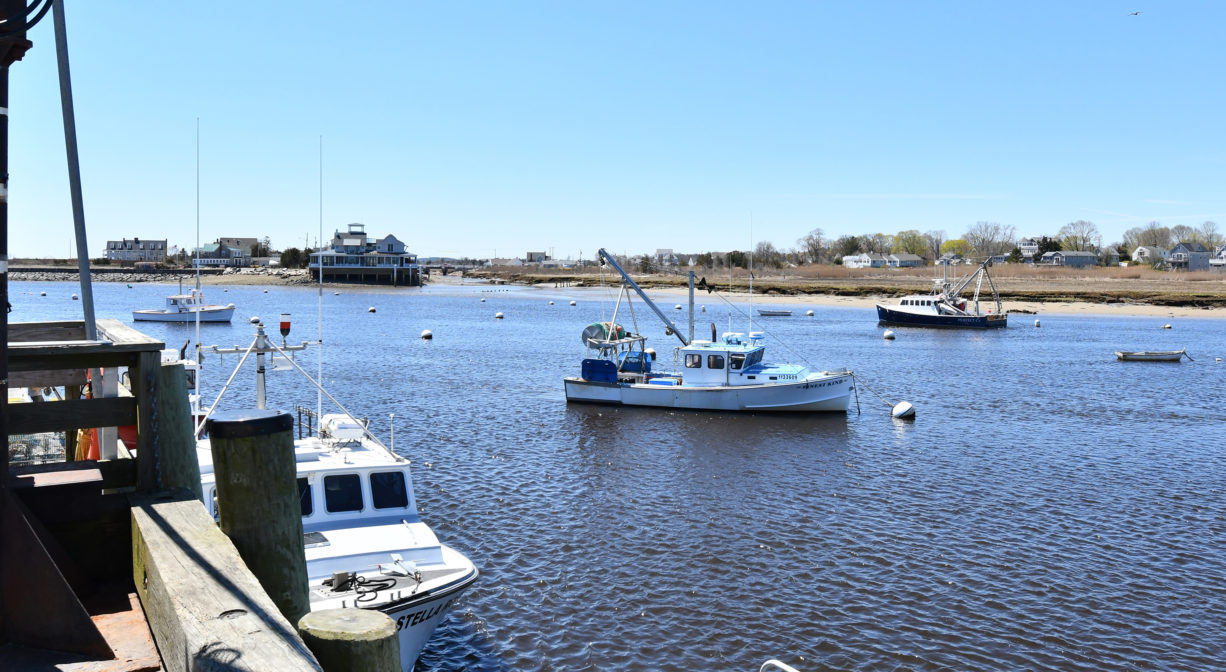 A photograph of fishing boats on a harbor.