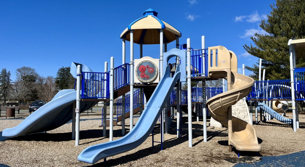 A photograph of a large play structure within a playground.