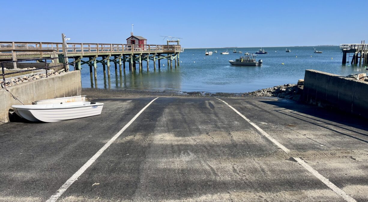 A photograph of a large boat ramp on a bay.