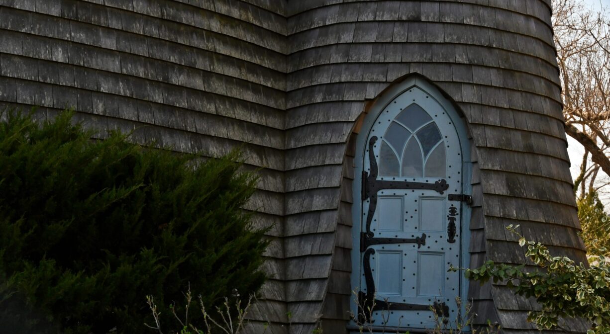 A detail photograph of the doorway to an ornate tower.