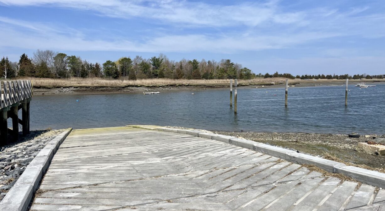 A photograph of a concrete launch ramp on a river.